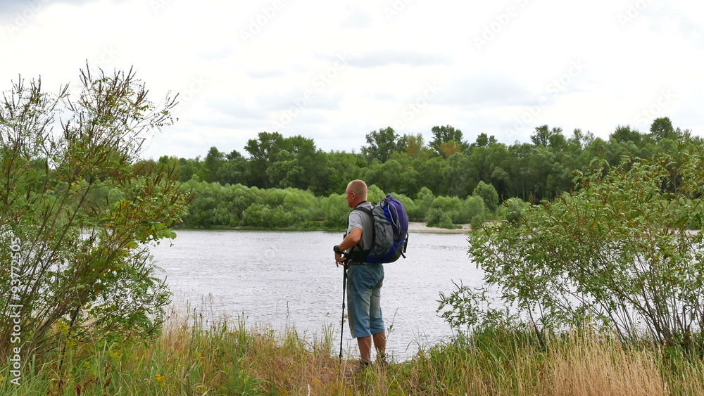 Man tourist on river bank looks in binocular and go away. 4K 3840x2160
Man tourist on river bank looks in binocular and go away. 4K 3840x2160