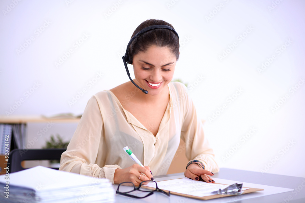 Close-up portrait of a customer service agent sitting at office Close-up portrait of a customer service agent sitting at office