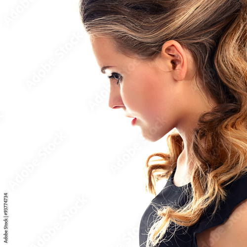 Bilde på lerret Portrait of a beautiful young woman in profile on a white background