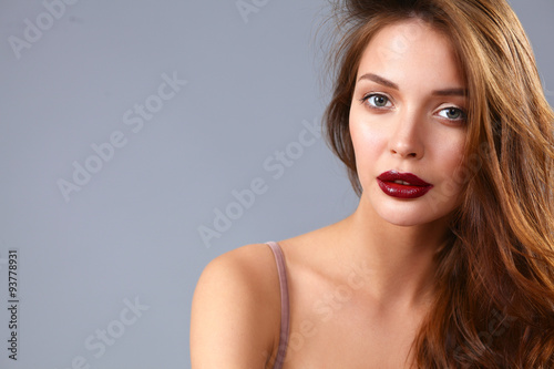 Portrait of beautiful woman , isolated on gray background