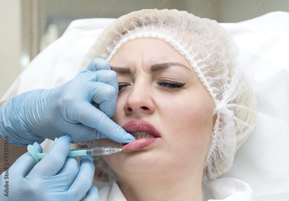 Naklejka premium Cosmetic treatment with injection in a clinic