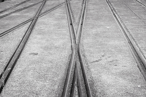 Background with railway crossing on gray asphalt