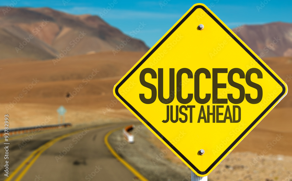 Success Just Ahead sign on desert road