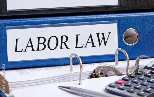 Labor Law - blue binder with text in the office