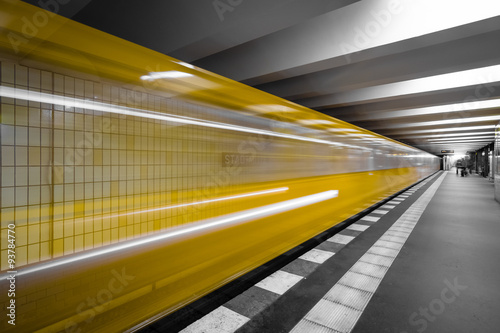Metro station. The arrival of the train. Motion blur. Combined toning.