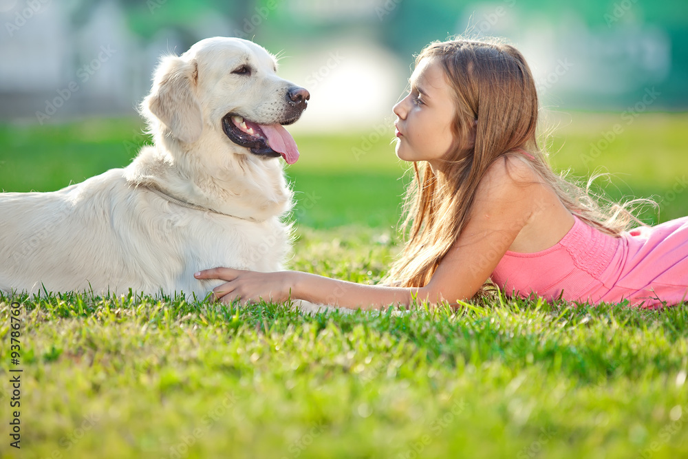 Happy kid with labrador in a nature Happy kid with labrador in a nature