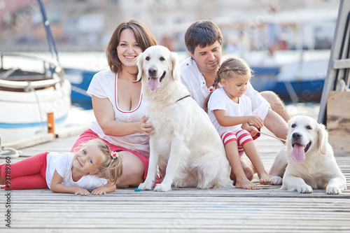 Happy family with dog friend