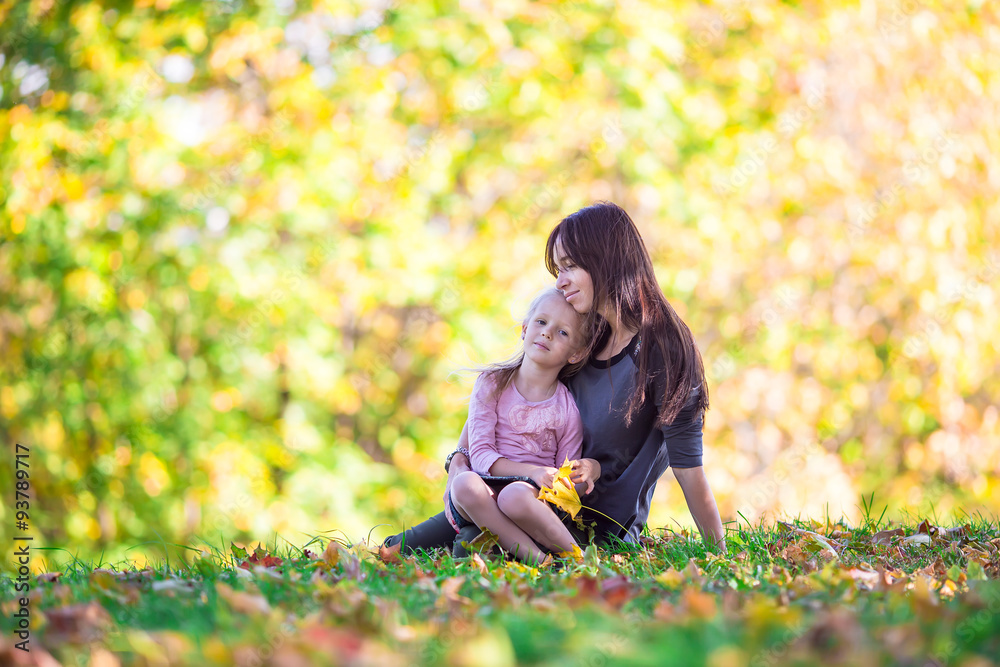 Adorable little girl with mother in autumn park outdoors Adorable little girl with mother in autumn park outdoors