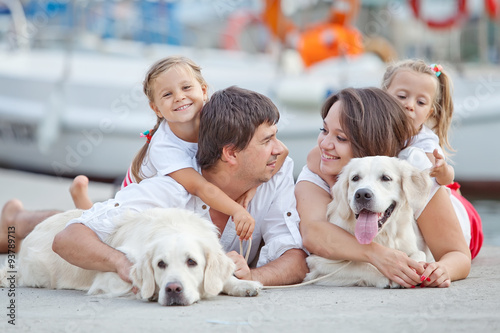 Happy family with dog friend