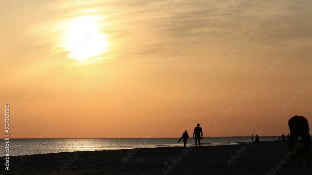 People walking on the beach People walking on the beach