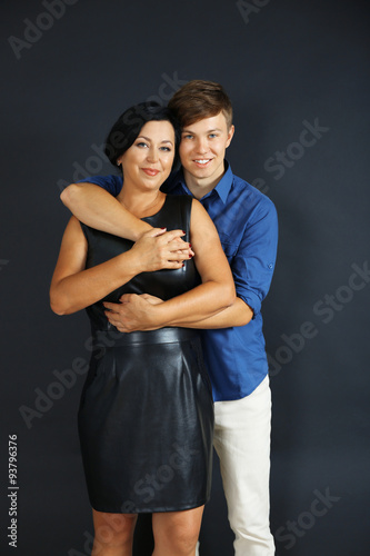 Portrait of mother and her son on dark background