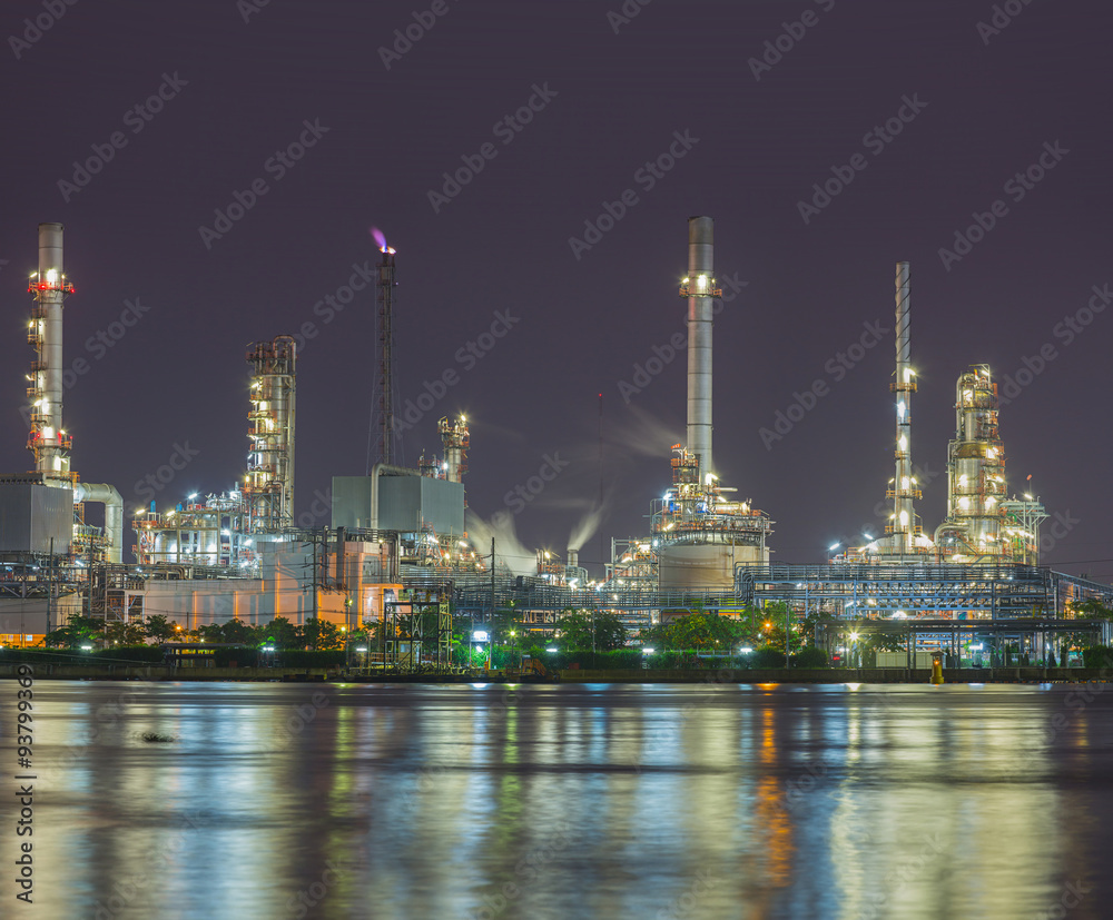 Twilight scene of refinery factory near river