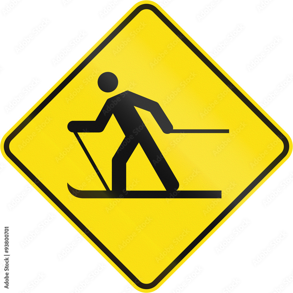 Warning road sign in Quebec, Canada - Skier crossing Warning road sign in Quebec, Canada - Skier crossing