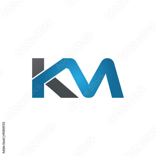 KM company linked letter logo blue photo