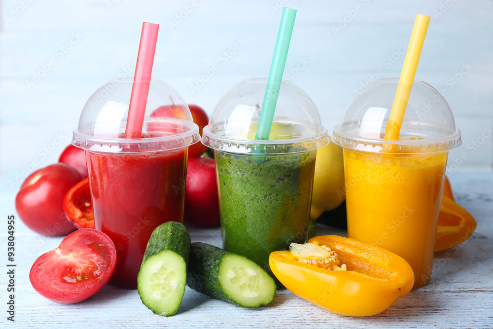 Fresh juice mix fruit, healthy drinks on color wooden background Fresh juice mix fruit, healthy drinks on color wooden background