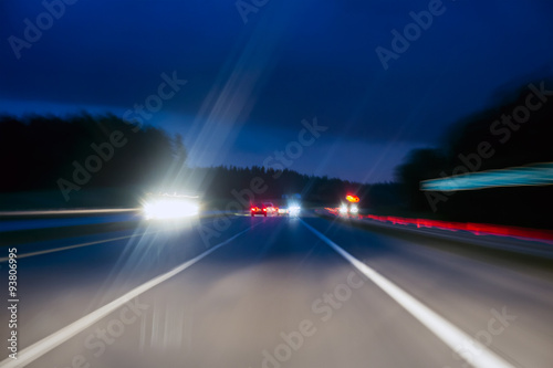 cars on a highway by night