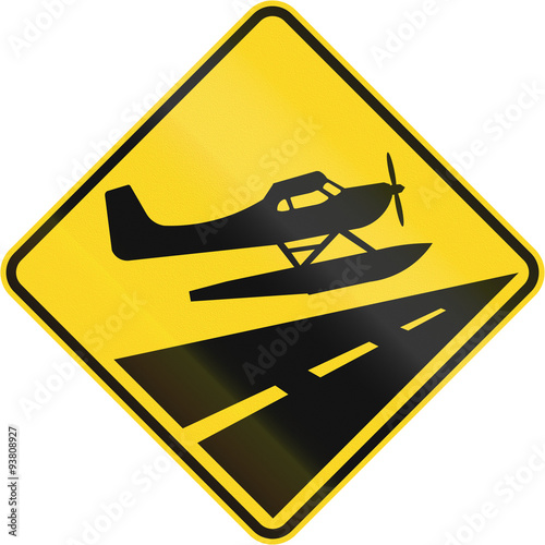 Warning road sign in Quebec, Canada - Low flying propeller planes photo