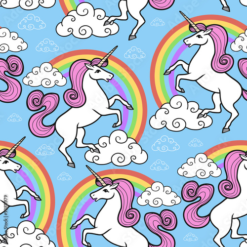 Cartoon vector seamless pattern. Unicorn with rainbow and clouds. For designed print.