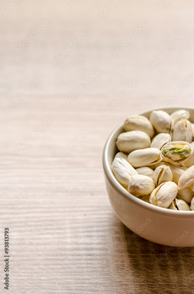 Close up Pistachios Nuts on wooden background Close up Pistachios Nuts on wooden background