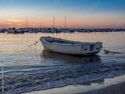 Lonely white boat on the Tuscan sea at sunset 3