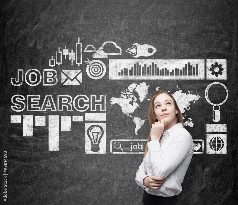 A beautiful lady in formal clothes is thinking about a new job. Black chalk board with drawn icons about job search process on the background. A beautiful lady in formal clothes is thinking about a new job. Black chalk board with drawn icons about job search process on the background.
