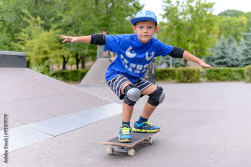 Young boy showing off on his skateboard