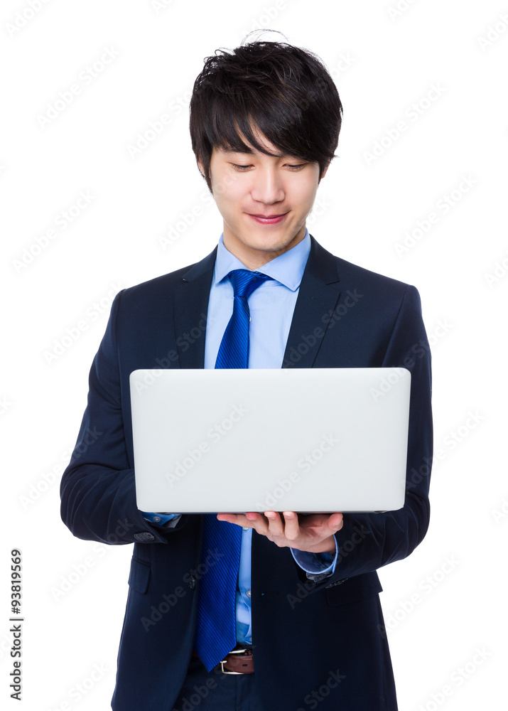 Asian Businessman use of the laptop computer Asian Businessman use of the laptop computer