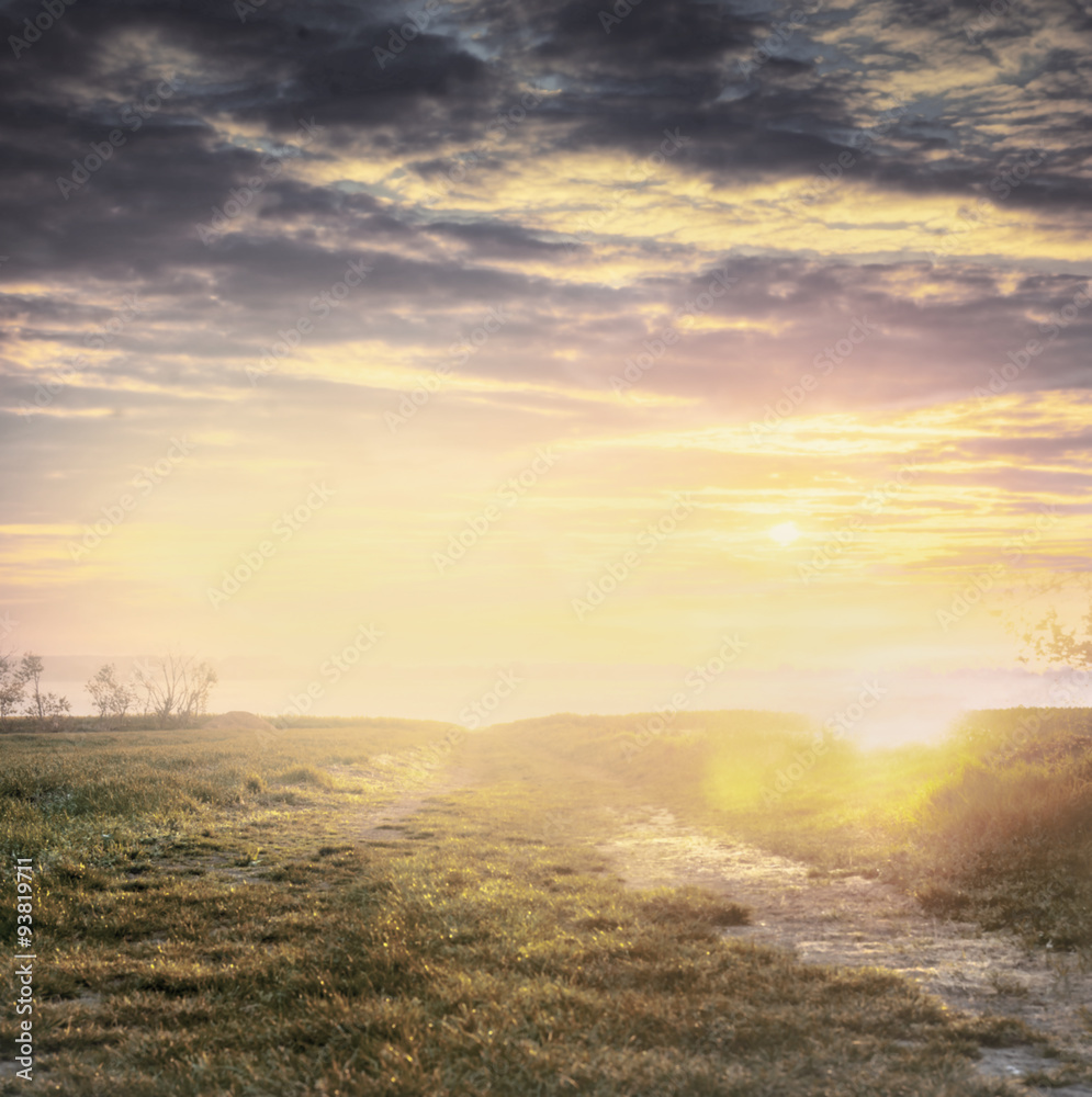 countryside blurred nature background with sunset sky, pastel toned