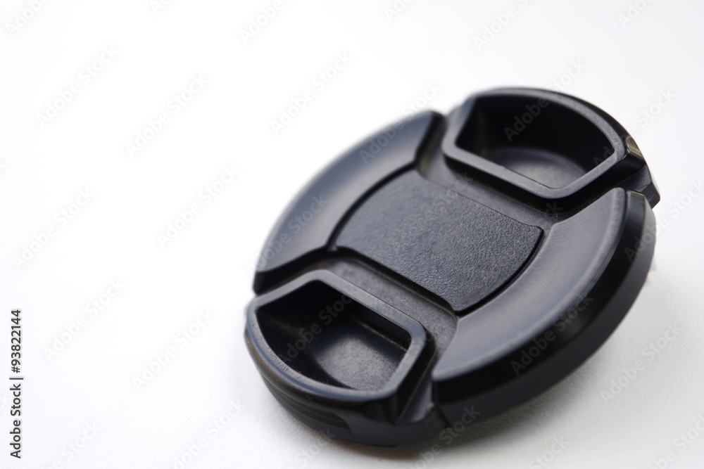Black lens cap isolated over white Black lens cap isolated over white