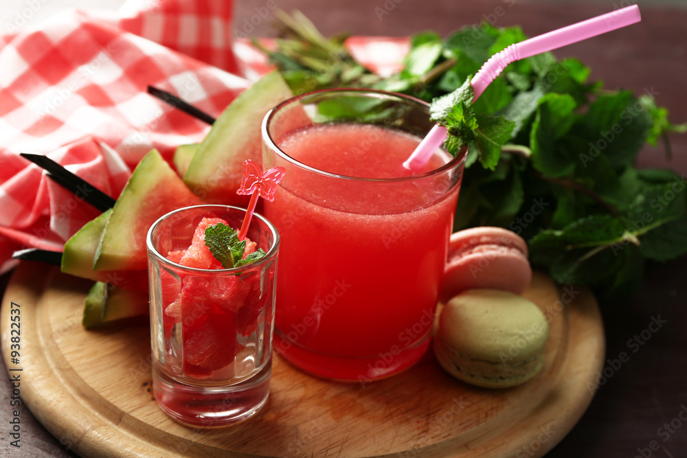 Cold watermelon desserts and drinks in glasses, on wooden table background Cold watermelon desserts and drinks in glasses, on wooden table background