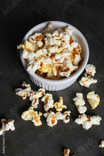Popcorn in bowl on dark background