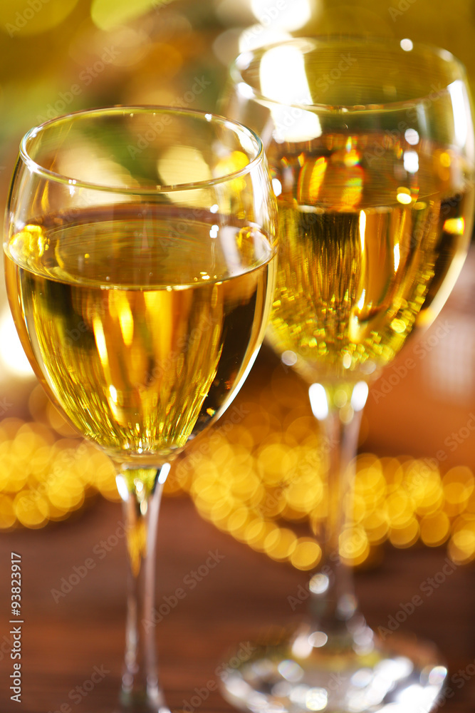 Champagne and Christmas decoration on bright background Champagne and Christmas decoration on bright background