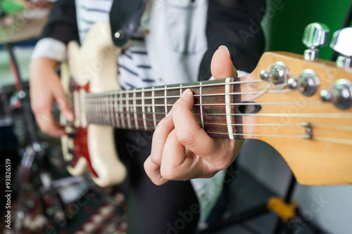 Midsection Closeup Of Woman Playing Guitar