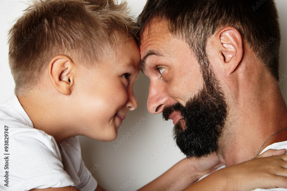 Portrait of a bearded man and young cute boy Portrait of a bearded man and young cute boy