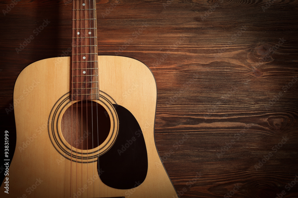 Fototapeta premium Guitar on wooden background