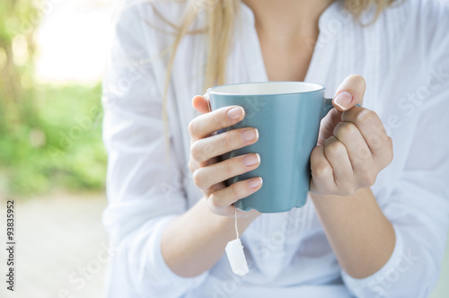 Woman holding tea mug