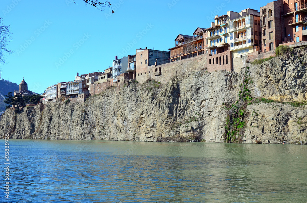 Traditional georgian architecture - beautiful buildings on the steep shore over the Kura River in Metekhi district. Tbilisi