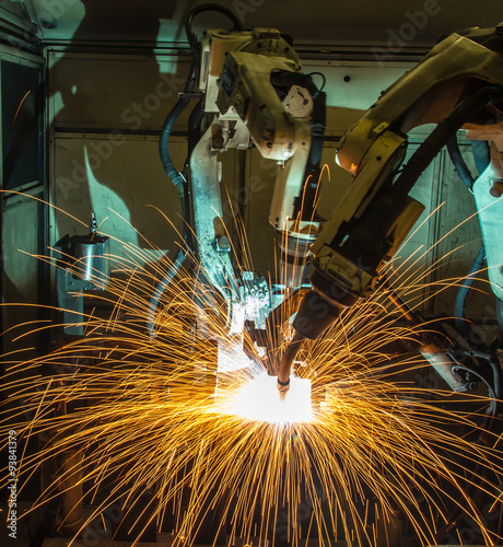 Team welding Robot movement Industrial automotive part in factory