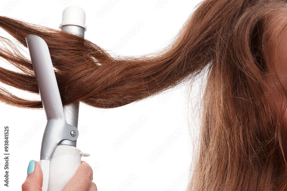 Naklejka premium Curling iron and hair