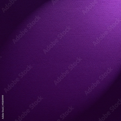 Purple felt background illuminated by a spotlight