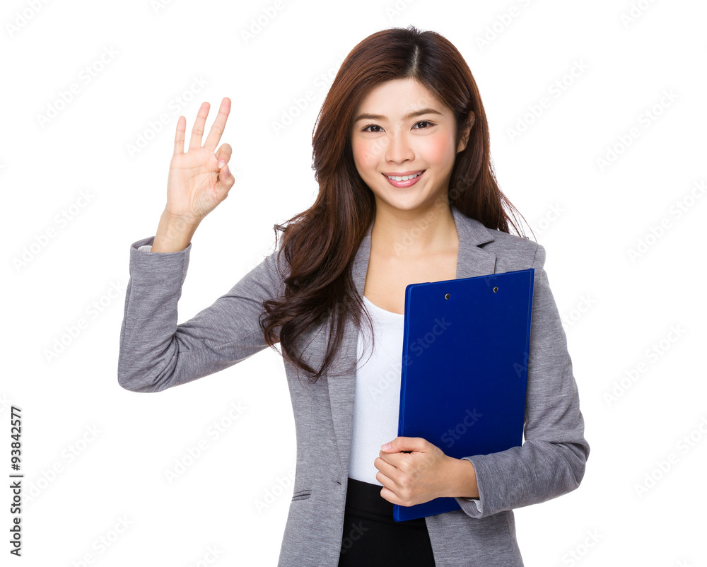 Businesswoman hold with clipboard and ok sign gesture Businesswoman hold with clipboard and ok sign gesture