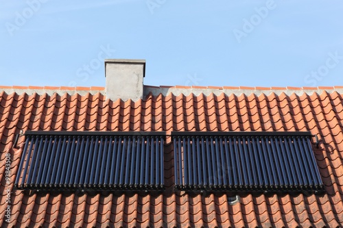 Solar glass tube hot water panel array on a roof