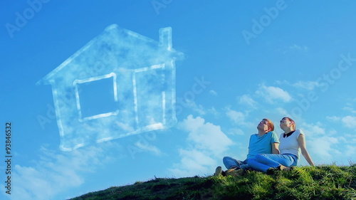 Young couple dreaming on the hill 