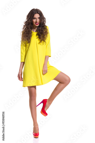 Fashion Model Standing On One Leg