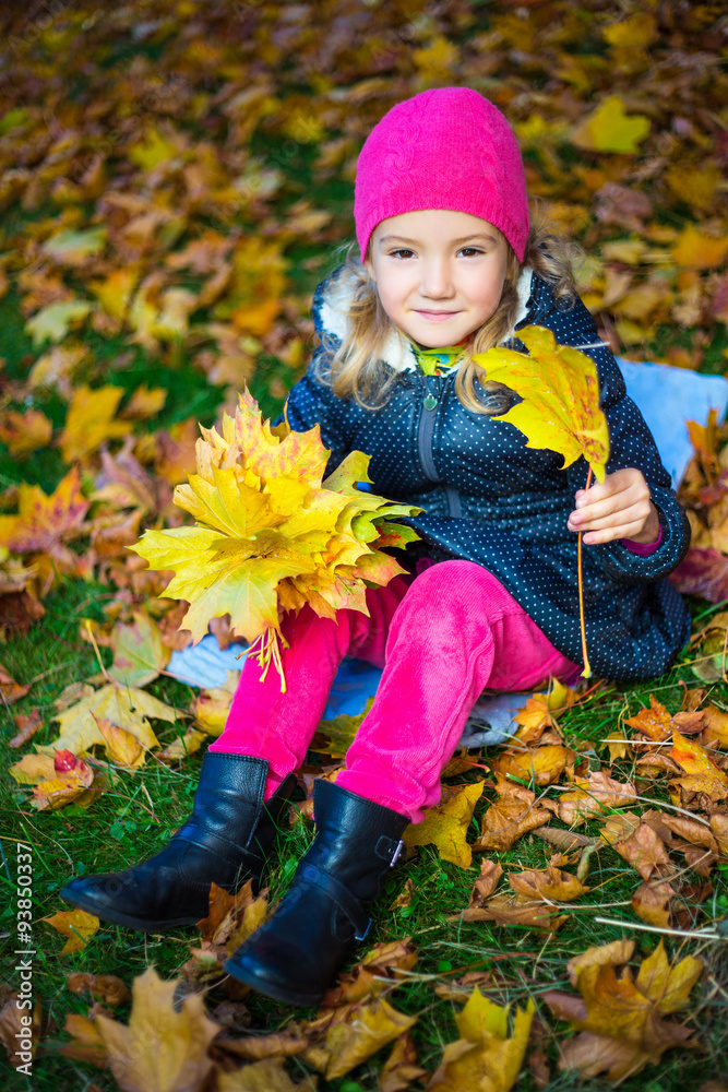 happy little girl with bouquet of maple leaves in autumn park happy little girl with bouquet of maple leaves in autumn park
