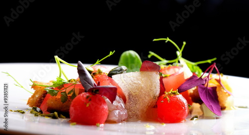 Haute cuisine appetizer with tuna tartare, watermelon and spices photo