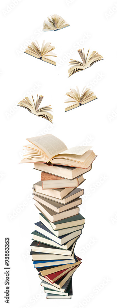 Naklejka premium Book pile with open books flying away isolated on white background. Education concept