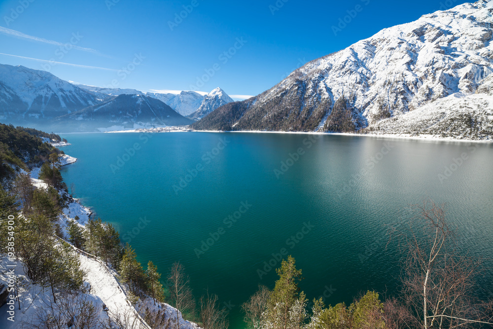 Idyllic snow landscape with mountain lake in the Alps, Achensee, Austria.