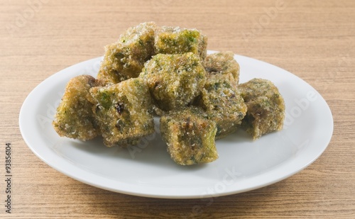 Plate of of Fried Steamed Dumpling Made of Garlic Chives photo