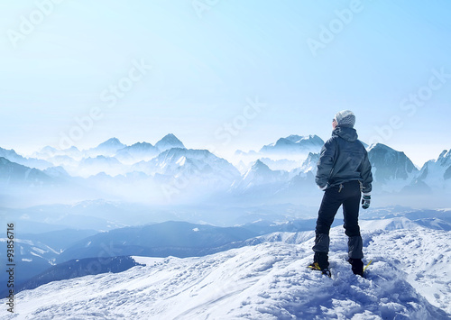 Silhouette of a champion on mountain peak. Active life concept
